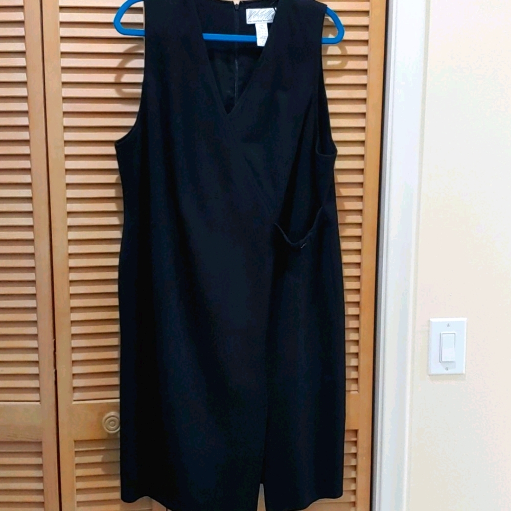 Black jumper. Attached belt as decor